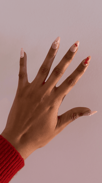 Allure contributor Jailynn Taylor after applying the Nail Reformation PressOn Nails in Cherry Picnic