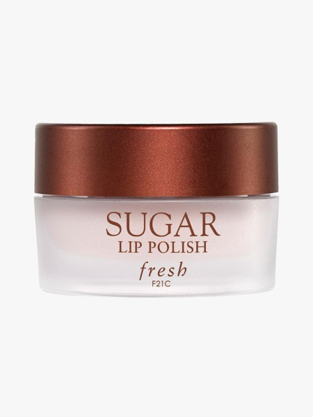 Fresh Sugar Lip Polish Exfoliator cloudy jar of lip scrub with bronze lid on light gray background