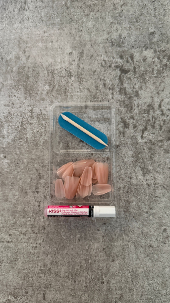 The Kiss Bare But Better TruNude PressOn Nails displayed flat on the counter