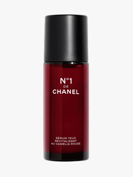 Chanel No.1 de Chanel Revitalizing Eye Serum in branded dark red bottle with black cap on light gray background